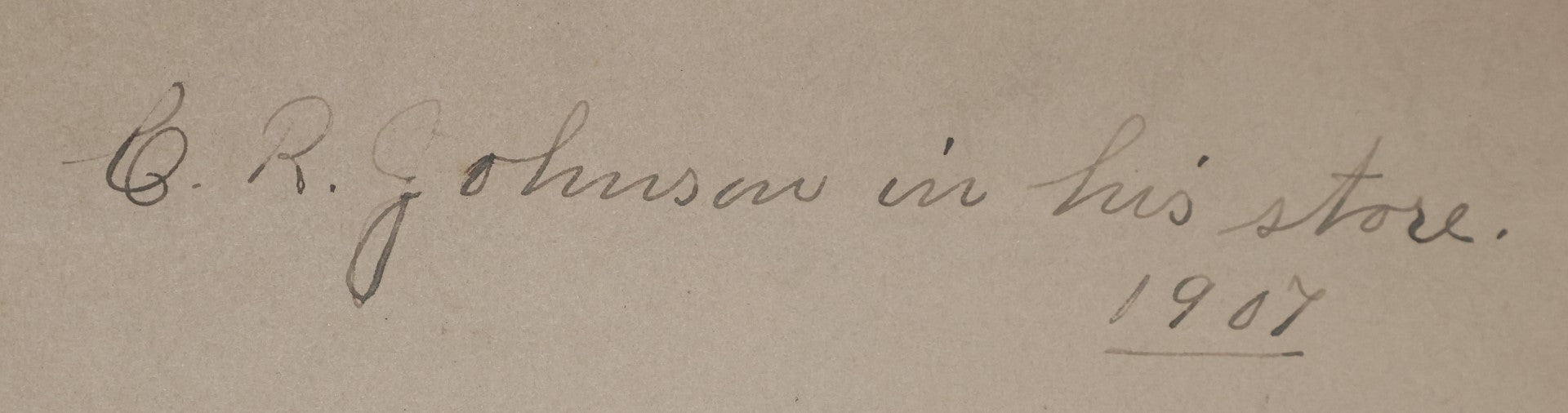Lot 026 - Antique Boarded Occupational Photograph Of A Shopkeeper In A General Store, Identified As C.R. Johnson, 1907, Products Visible, Including Campbell's Soup Cans