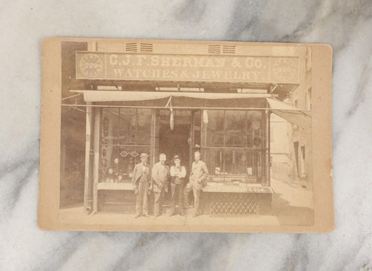 Lot 028 - Antique Cabinet Card Occupational Photograph Of C.J.F. Sherman & Co., Watches And Jewelry, With Men Outside, Note Optometrist Glasses Sign In Window, By Rand & Gould, Photographers, Boston