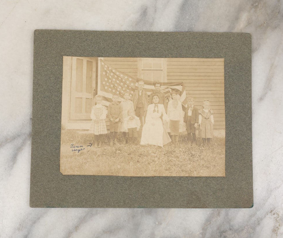 Lot 030 - Antique Boarded Photograph Of A Woman And Children In Front Of As 48 Star American Flag, Early 20th Century, Little Girl Identified As Teresa Heyes