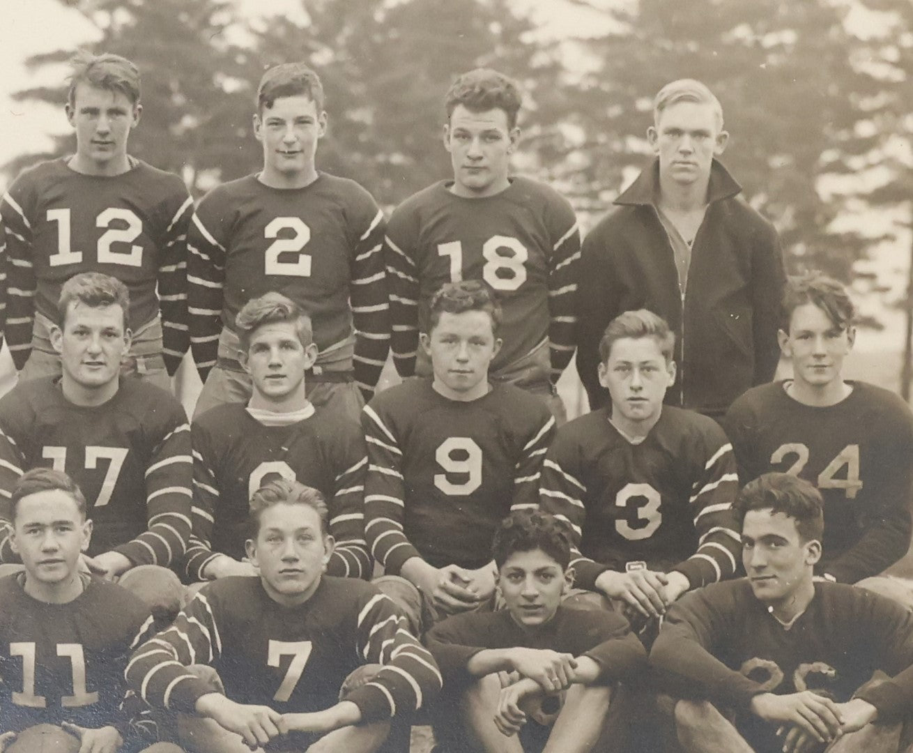 Lot 034 - Vintage Boared Photograph Of An High School Boys American Football Team, In Numbered Uniforms, No Location Given, Young Coach In Photo