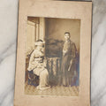 Lot 036 - Antique Boarded Photo Of A Young Chinese Couple, Man And Woman In Traditional Dress, Text On Back Of Board Translates To "Photo Post"