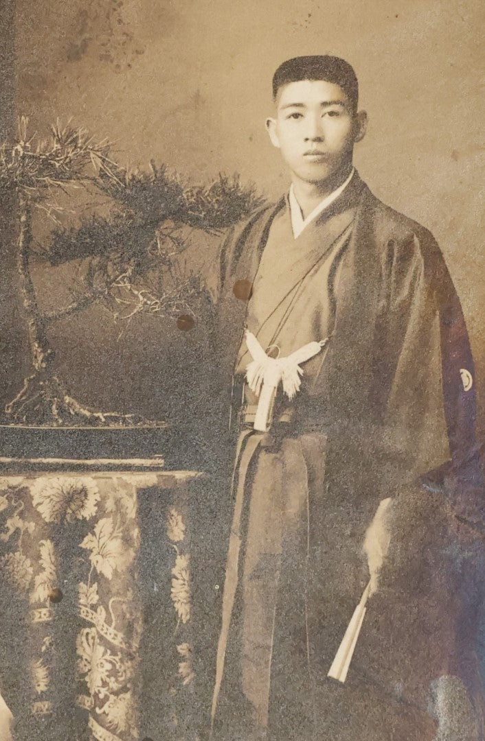 Lot 036 - Antique Boarded Photo Of A Young Chinese Couple, Man And Woman In Traditional Dress, Text On Back Of Board Translates To "Photo Post"