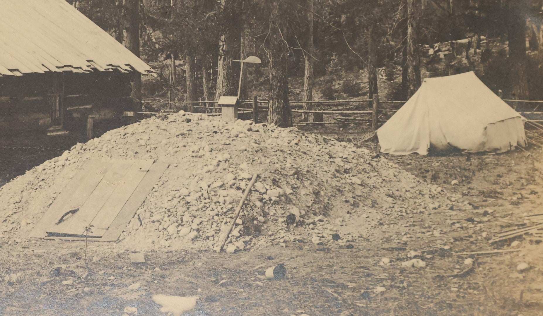 Lot 037 - Antique Boarded Photograph Of The Homestead Of Andrew Young, Kalispell, Montana, With Root Cellar And Chicken Tent, Dog In Photo, Dated September 12, 1897