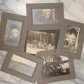Lot 038 - Grouping Of Six Antique Boarded Photographs Related To Hunting And The Outdoors, Including Strung Up Deer, Group Photo With Man Shooting Rifle, Photo With People Holding Oars, Lake