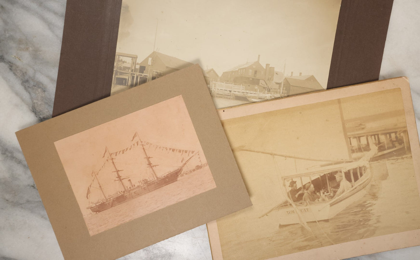 Lot 040 - Grouping Of Three Antique Boarded Photos Of Maritime Scenes, Including "Tom Cat" Boat, The U.S.S. Hartford, Circa 1875, Gloucester, Massachusetts, And A Dock / Pier