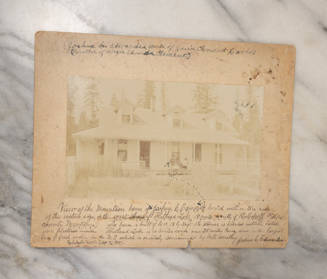 Lot 044 - Grouping Of Eight Photographs Of The Exteriors Of Buildings And Homes, Municipal Buildings And More, Including Mountain Home Of Joshua Edwards, Kalispell, Montana, 1897