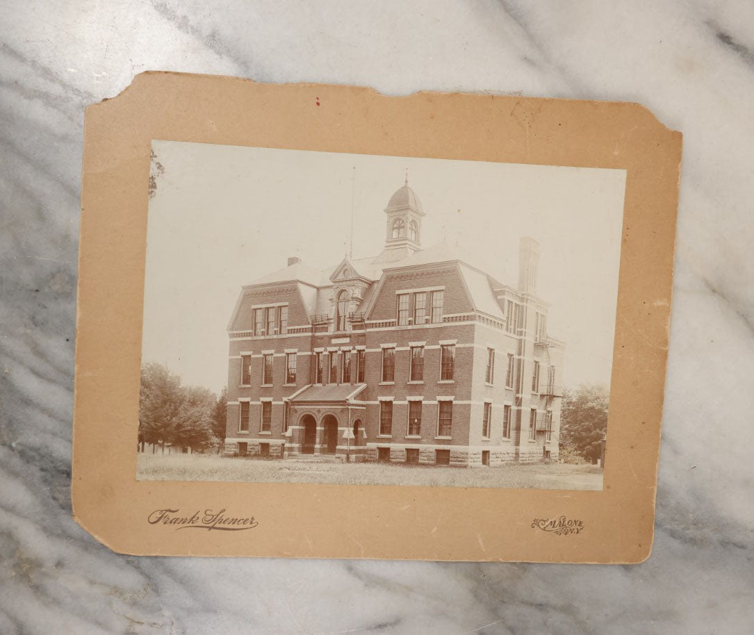 Lot 044 - Grouping Of Eight Photographs Of The Exteriors Of Buildings And Homes, Municipal Buildings And More, Including Mountain Home Of Joshua Edwards, Kalispell, Montana, 1897