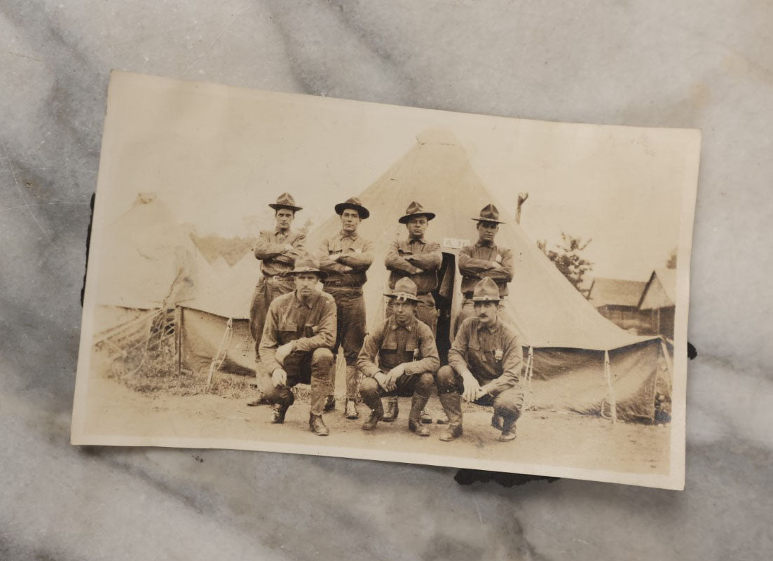 Lot 048 - Grouping Of Four Vintage Snapshot Photographs Of Soldiers, Including Airmen In Front Of Plane, Soldier With Dog, Man Working Communications, And More