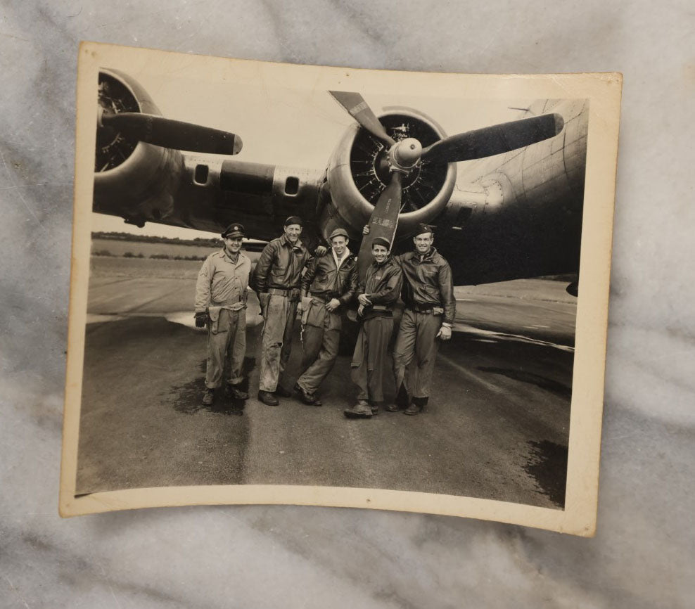 Lot 048 - Grouping Of Four Vintage Snapshot Photographs Of Soldiers, Including Airmen In Front Of Plane, Soldier With Dog, Man Working Communications, And More