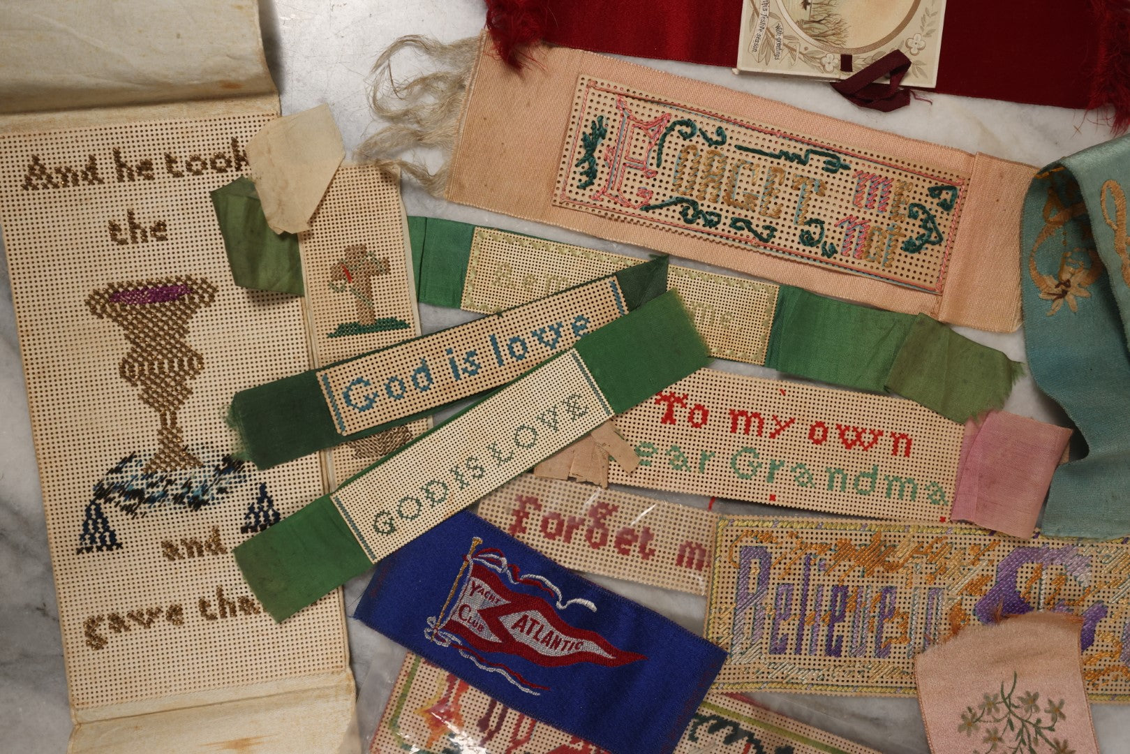 Lot 064 - Grouping Of 10+ Antique Punchwork Punched Paper Embroidered Bookmarks And More, Including Remember Me, God Is Love, Forget Me Not, And More