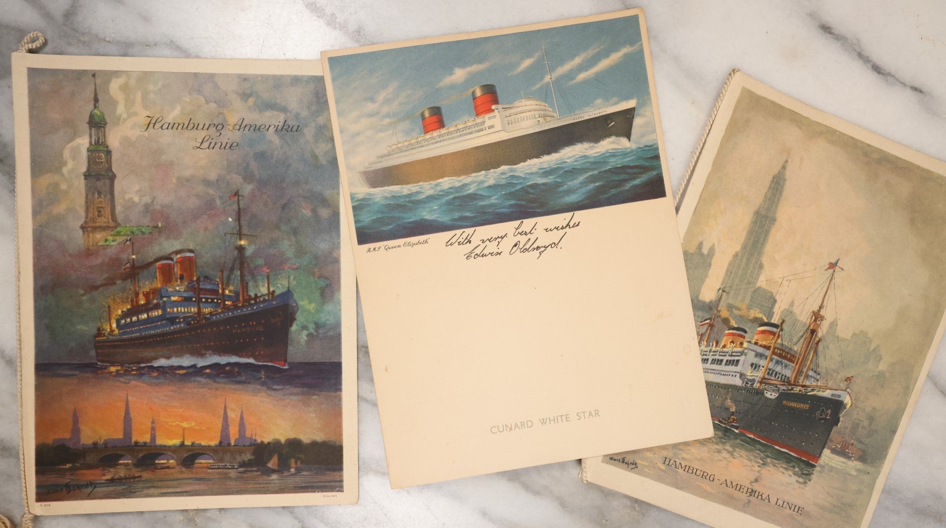 Lot 079 - Grouping Of Three Vintage Ocean Liner Ship Farewell Dinner Menus, Including Hamburg Amerika Line, S.S. Hamburg 1929, M.S. Milwaukee 1929, And White Star Line R.M.S. Queen Elizabeth 1954