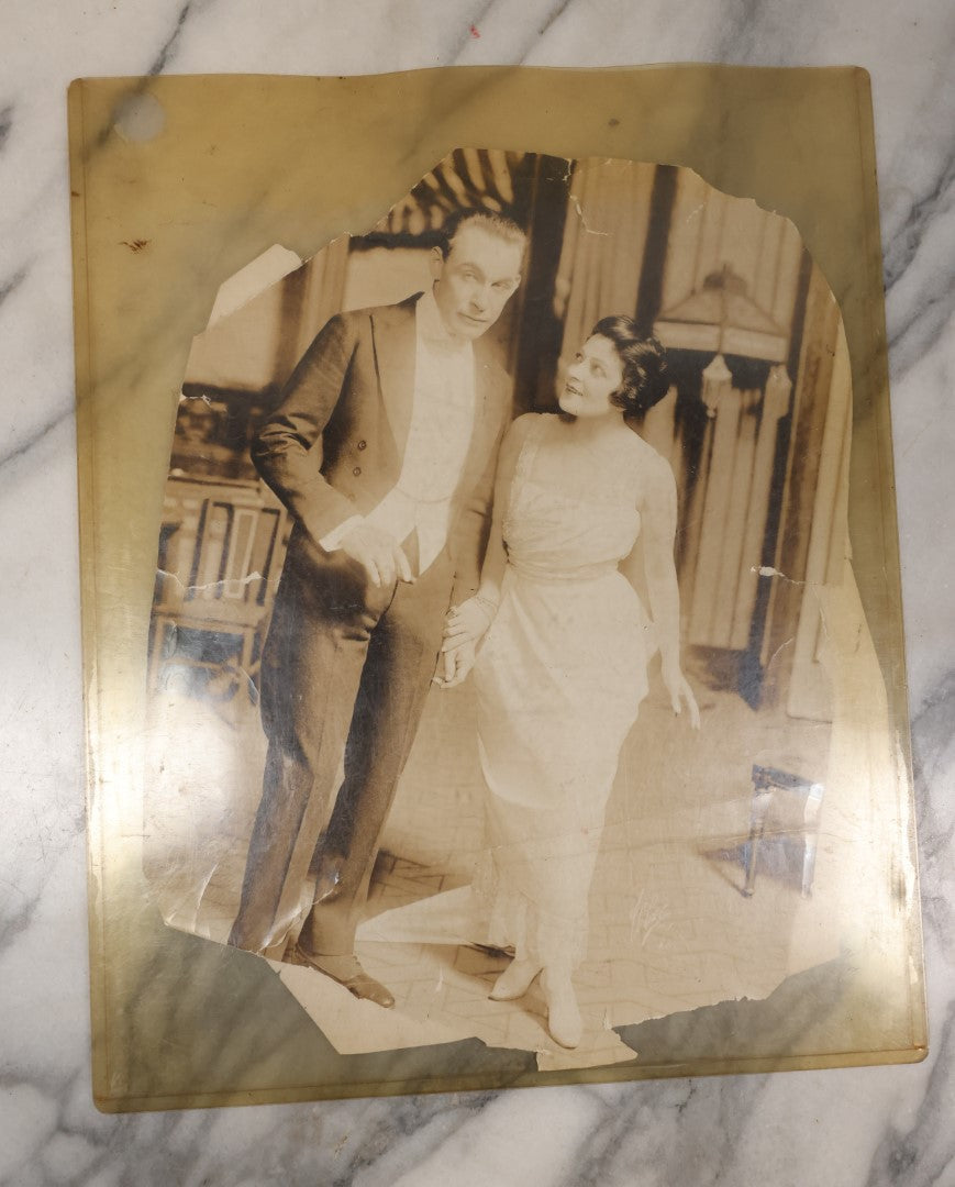 Lot 110 - Pair Of Poor Condition Large Size Vaudeville Era Promo Photos, With "Dolly" Floral Arrangement, Unknown Origin, Very Damaged, Worn