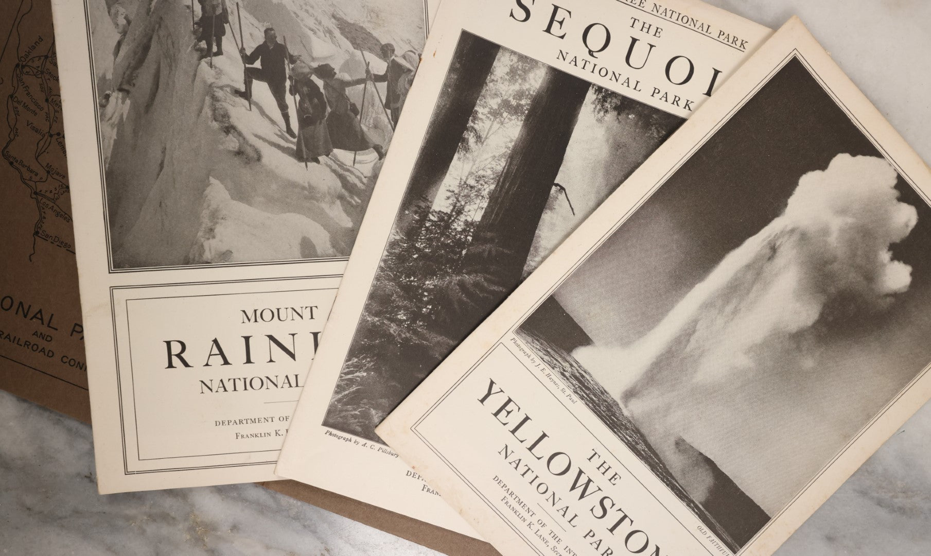 Lot 115 - National Parks Portfolio Folder With Booklets On Mount Rainier, Equoia, And Yellowstone National Parks, Published By The Department Of The Interior