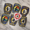 Lot 135 - Grouping Of Seven Recent Modern Salem Massachusetts Police And Fire Patches, With Witch City, With Witch Graphic, Including Pride Patches, Bike Unit, And Others