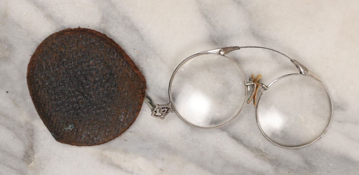 Lot 148 - Single Junk Drawer Finding, Spring Loaded Fold Up Eye Glasses With Case, Note Case Split