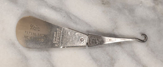 Lot 152 - Single Junk Drawer Finding, Antique Folding Button Hook Tool And Shoehorn, Advertising Saks Fifth Avenue, New York, Patented 10-9-1917