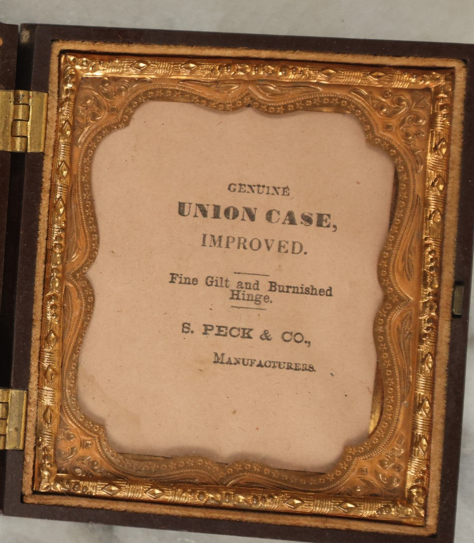 Lot 014 - Antique 1/6th Plate Ambrotype Photograph Of A Woman In A Hooded Cape With Bonnet, In Double Union Case By S. Peck & Co., Manufacturers, Note Scuffs, Scratches To Photo