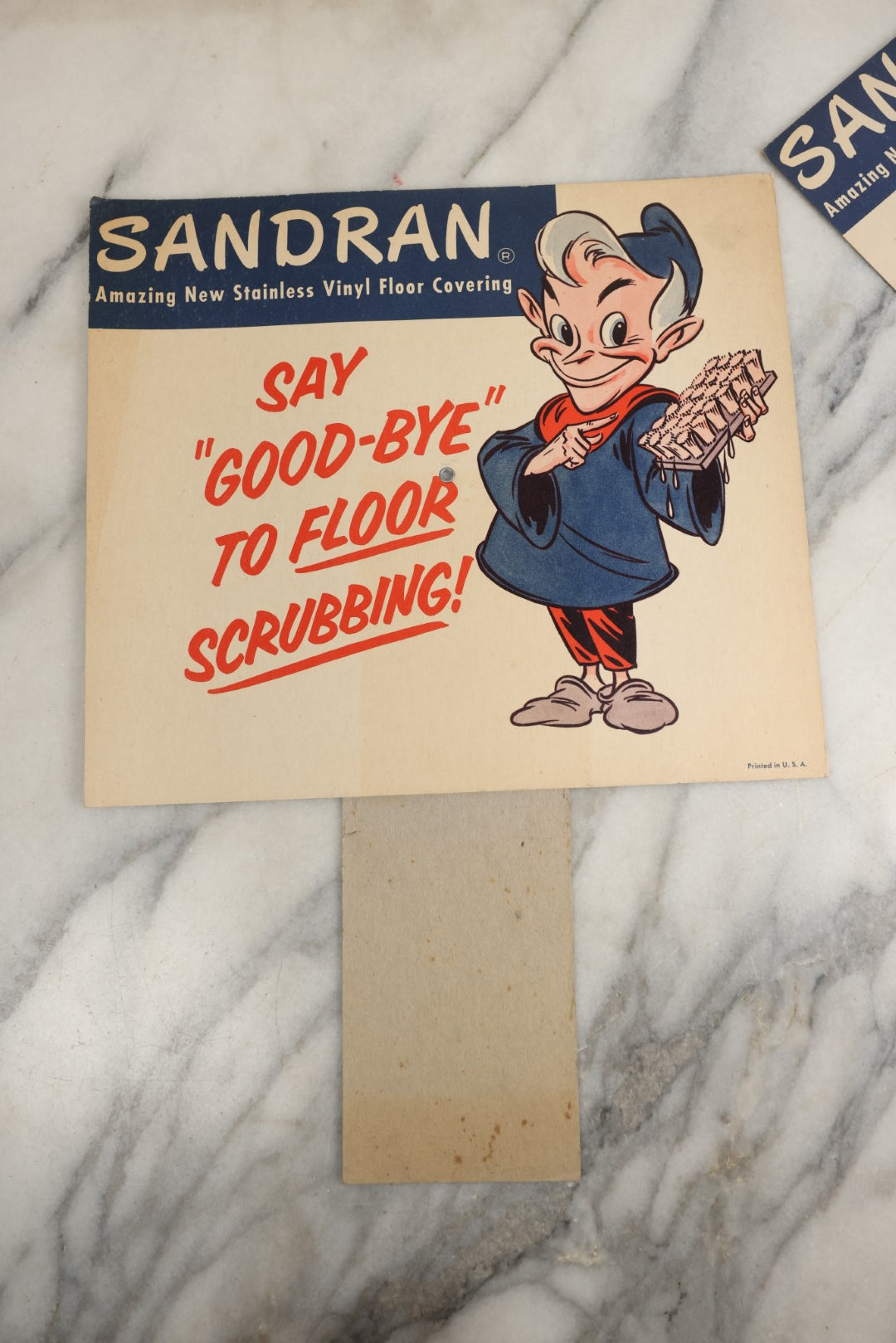 Lot 168 - Grouping Of Three Vintage Advertisements For Sandran Stainless Vinyl Floor Covering, With Elf Character