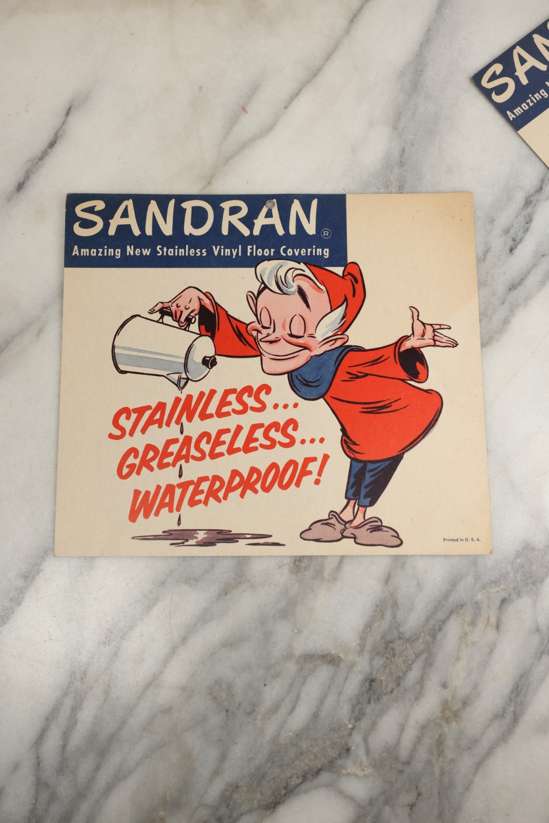 Lot 168 - Grouping Of Three Vintage Advertisements For Sandran Stainless Vinyl Floor Covering, With Elf Character