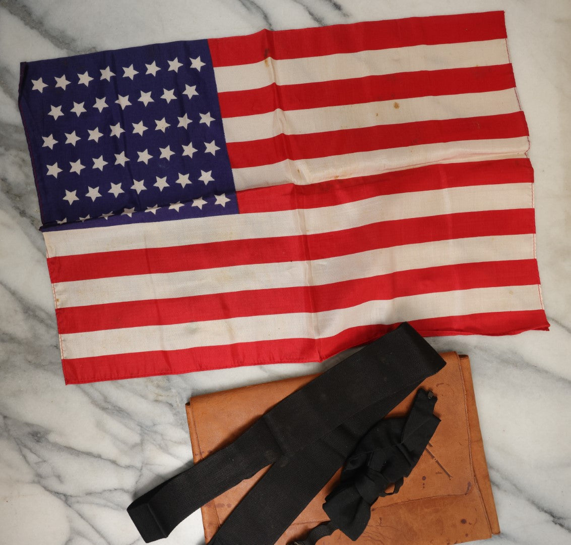 Lot 182 - Antique Small Size 46-Star Silk American Flag In Custom Leather Case With Bow Tie, As Found