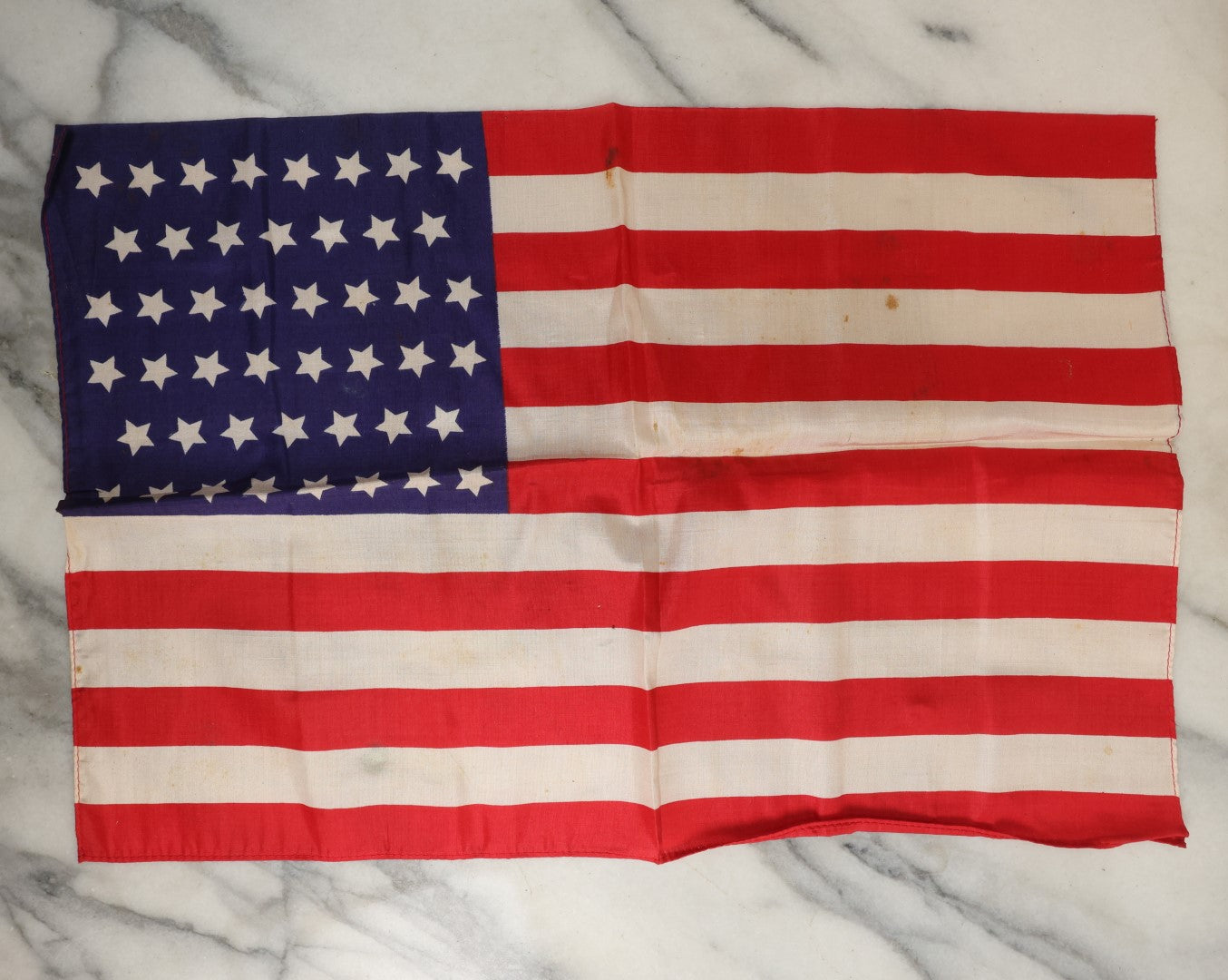 Lot 182 - Antique Small Size 46-Star Silk American Flag In Custom Leather Case With Bow Tie, As Found