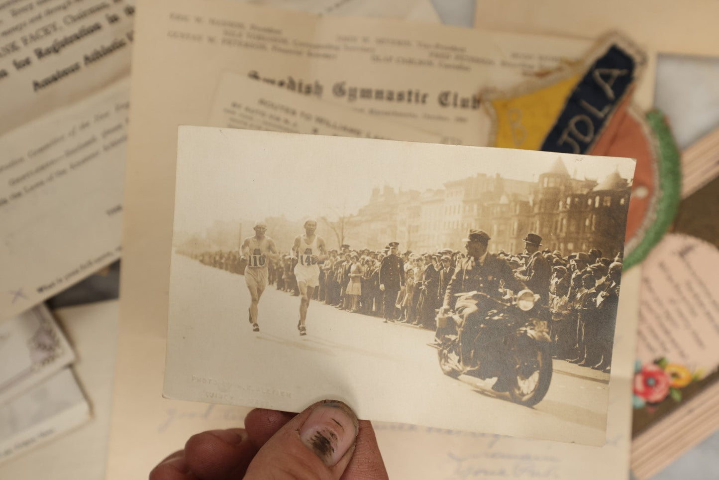 Lot 183 - Estate Ephemera Grouping Related To Boston Swedish Gymnastic Club Posse, Circa 1930s, Including Chocolate Box Found In, Includes Map Of New York City, Real Photo Postcard Of Motorcycle Cop And Boston Marathon, Hand Made Patch, Etc, As Found