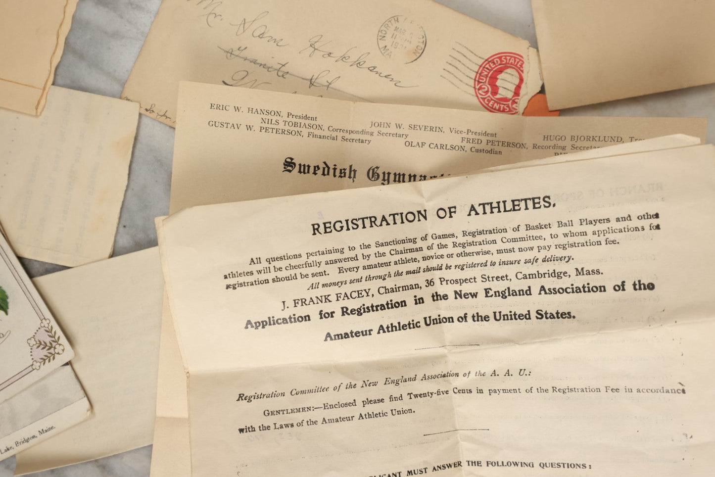 Lot 183 - Estate Ephemera Grouping Related To Boston Swedish Gymnastic Club Posse, Circa 1930s, Including Chocolate Box Found In, Includes Map Of New York City, Real Photo Postcard Of Motorcycle Cop And Boston Marathon, Hand Made Patch, Etc, As Found