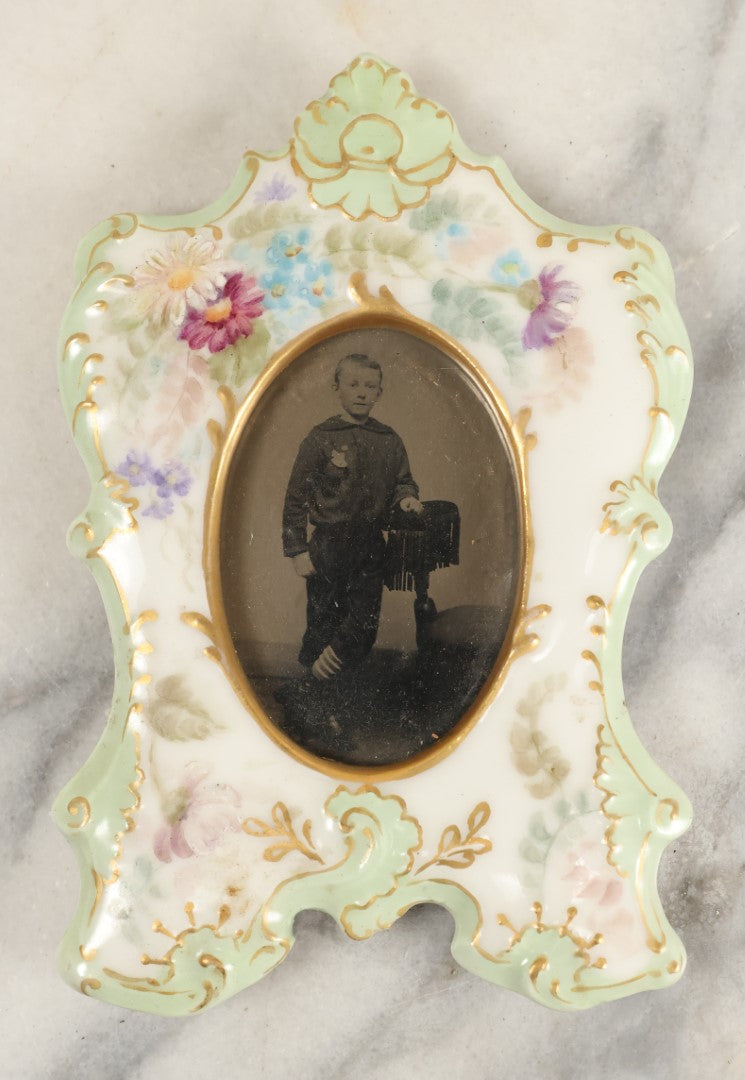 Lot 184 - Antique Tintype Photograph Of A Young Boy In Striped Socks In A Hand Painted Porcelain Frame