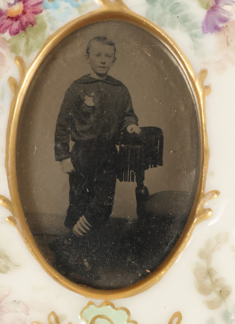 Lot 184 - Antique Tintype Photograph Of A Young Boy In Striped Socks In A Hand Painted Porcelain Frame