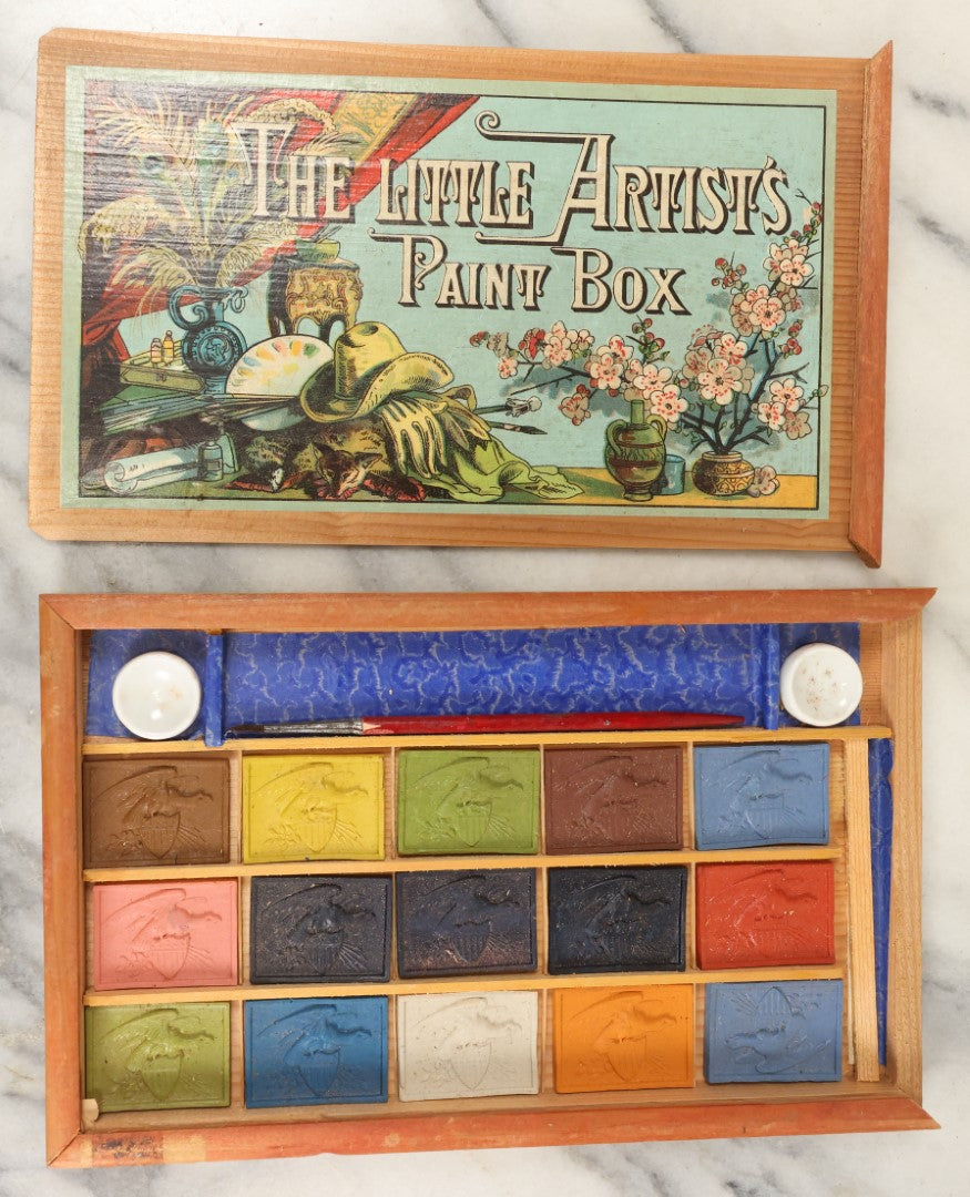 Lot 188 - The Little Artist's Paint Box, Wooden Paint Box With Lithographed Paper Label Containing Unused Blocks Of Water Color Paint With Patriotic Design, Appears To Be Complete, Unused
