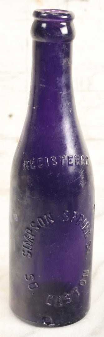 Lot 196 - Grouping Of Three Vintage And Antique Purple Glass Bottles, Including F.W. Kuenhold, Hartford, Connecticut, Sampson Springs Co., South Boston, And Brockton Bottling Co, Massachusetts