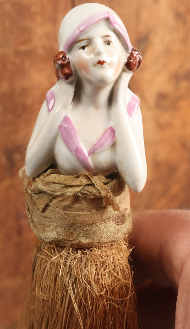 Lot 204 - Porcelain Flapper Woman Straw Dresser Brush, Hand Painted With Pink Detailing, Note Somewhat Loose