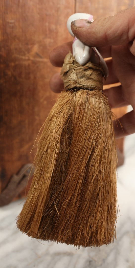 Lot 204 - Porcelain Flapper Woman Straw Dresser Brush, Hand Painted With Pink Detailing, Note Somewhat Loose