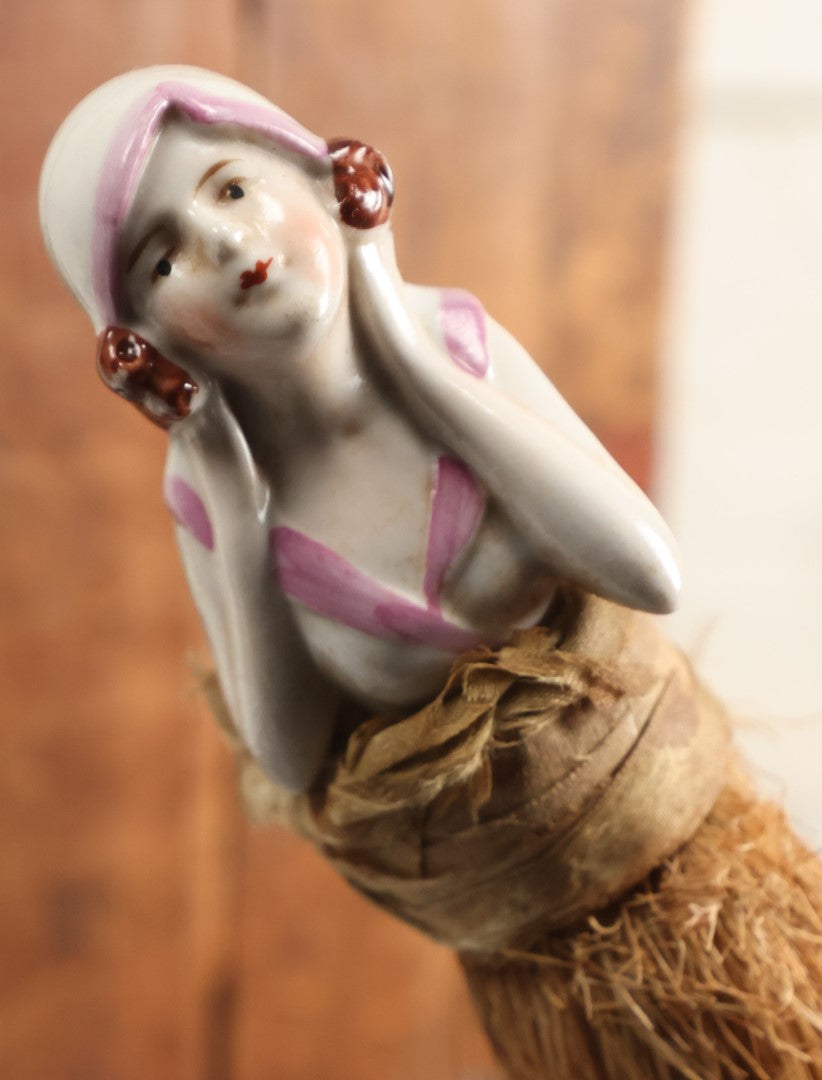 Lot 204 - Porcelain Flapper Woman Straw Dresser Brush, Hand Painted With Pink Detailing, Note Somewhat Loose