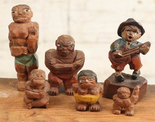 Lot 206 - Grouping Of Six Hand Carved Folk Art Painted Wooden Men, Including Little Man Singing And Playing Guitar, Wrestlers, And More