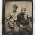 Lot 020 - Single Antique Tintype Photograph Of Two Young Boys On A Bench, One With A Monogrammed Jersey, Appears To Say C.H.S., Other In Suit