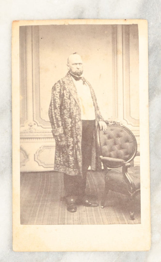 Lot 025 - Single Antique Carte De Visite C.D.V. Photograph Of A Portly Elder Man In An Extravagantly Decorated Coat, With Hand On Chair, Cahill Photographer, Boston