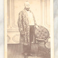 Lot 025 - Single Antique Carte De Visite C.D.V. Photograph Of A Portly Elder Man In An Extravagantly Decorated Coat, With Hand On Chair, Cahill Photographer, Boston