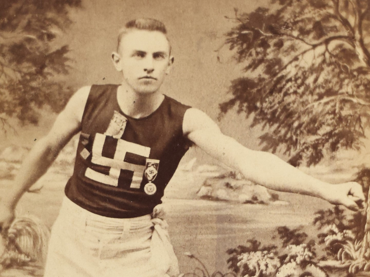 Lot 028 - Antique Cabinet Card Photograph Of A Late 19th Century Athlete, Likely Track And Field, Wearing A Shit And Badges With A Swastika "Whirling Logs" Good Luck Insignia, T.H. Pickles, Photographer, East Cambridge, Massachusetts, See Notes