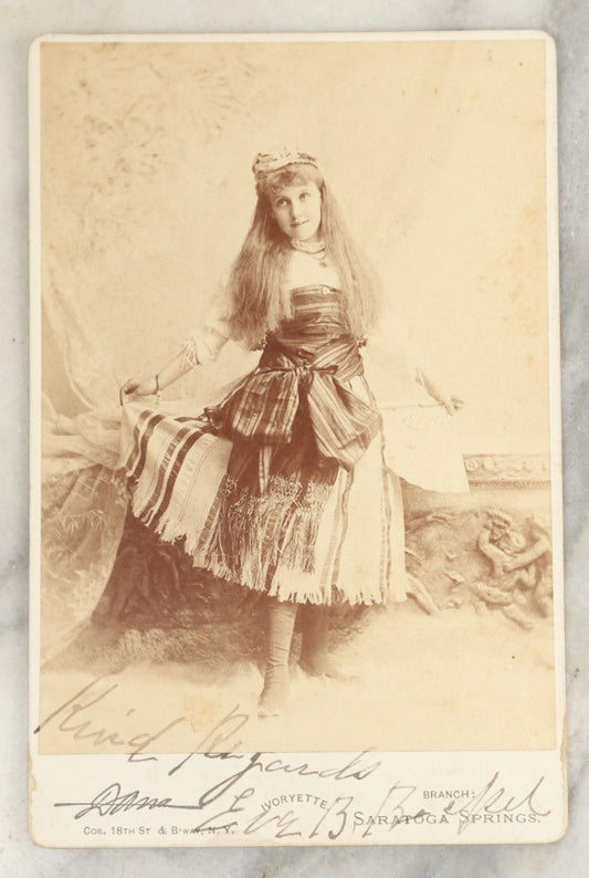 Lot 030 - Antique Cabinet Card Photograph Of A Young Girl In Costume, Likely A Performer Or Actress, Signed By Eva, Dana Photographer, Saratoga Springs, New York