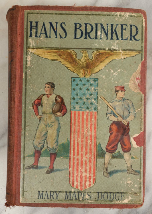 Lot 035 - "Hans Brinker Or The Silver Skates: A Story Of Life In Holland" Antique Book By Mary Mapes Dodge, Published By Hurst & Company, New York, With Baseball Player And Football Player On Cover