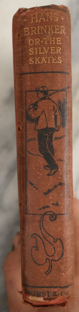 Lot 035 - "Hans Brinker Or The Silver Skates: A Story Of Life In Holland" Antique Book By Mary Mapes Dodge, Published By Hurst & Company, New York, With Baseball Player And Football Player On Cover