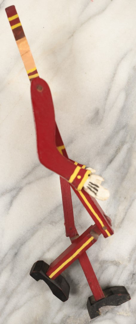 Lot 080 - Vintage Folk Art Wood Cut Bellhop Or Trainman Jointed Figurine, Hand Cut And Hand Painted, Red Clothes