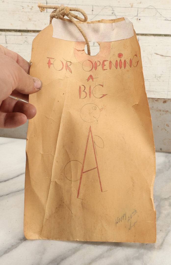 Lot 091 - Vintage Folk Art Welded Jumbo Novelty Bottle Opener, With Attached Note "For Opening A Big A" With Comic Drawing, 26th Birthday Gift