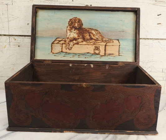 Lot 092 - Antique Folk Art Pyrography Flemish Art Wood Burned Box With Dog Floating In Water On Trunk, Hand Painted Blue Sky Backdrop, Woman On Top Of Cover
