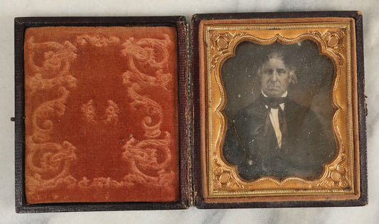 Lot 097 - Antique 1/6th Plate Daguerreotype Photograph Of An Older Man With White Hair, Wearing Suit With Black Bow Tie, In Repaired Leatherette Case