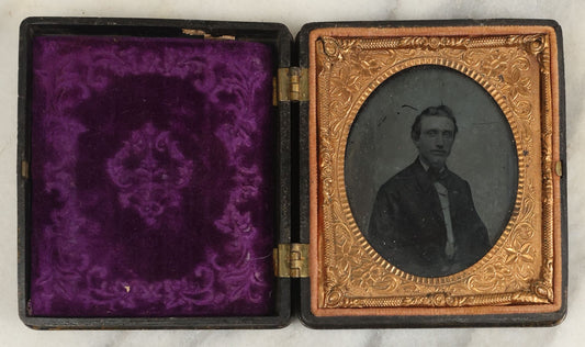 Lot 103 - Antique 1/6th Plate Ruby Ambrotype Of Young Man With Small Beard, In Thermoplastic Case, Note Purple Pillow Added, Not Original
