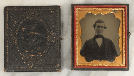 Lot 105 - Antique 1/6th Plate Ambrotype Of An Older Man With Odd Looking Eyes, Likely Blue Eyes, In Split Complete Patriotic Letherette Union Case, With Eagle Holding Shield, Flags