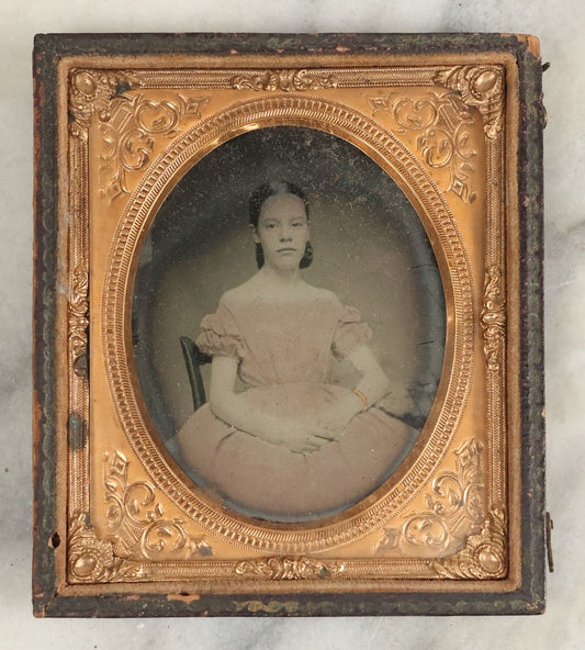 Lot 110 - Antique 1/6th Plate Ambrotype Of A Pretty Young Girl In A Pink Tinted Off-The-Shoulders Dress, Gold Tinted Bracelet, In Half Leatherette Case