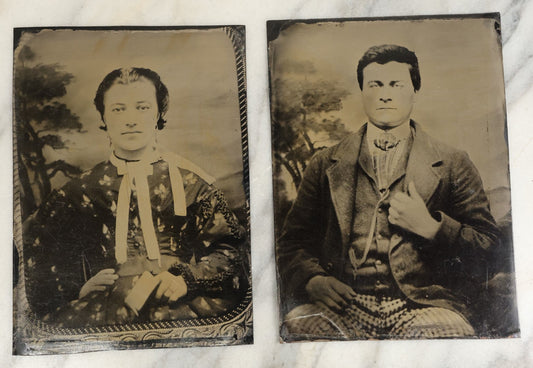 Lot 119 - Pair Of Approximately Half Plate Tintypes Of A Man And Women, Likely A Couple, Note Woman Holding Small Book, One Lot One Money